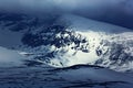 Winter in the mountain. Foggy morning in Italian Alps, early morning in the mountain with snow during violet twilight, hills in th