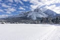 Winter mountain landscape with groomed ski trails