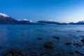 Winter mountain landscape with icy lake and snow-capped mountains Royalty Free Stock Photo