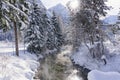 Winter mountain landscape with river or stream. Trees covered with snow and hoarfrost. Royalty Free Stock Photo