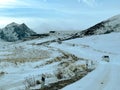 Winter mountain landscape with a road