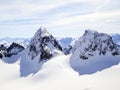 Winter mountain landscape in the Silvretta mountain range in the Swiss Alps with famous Piz Buin mountain peak in the center Royalty Free Stock Photo