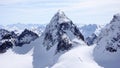 Winter mountain landscape in the Silvretta mountain range in the Swiss Alps with famous Piz Buin mountain peak in the center Royalty Free Stock Photo