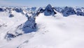 Winter mountain landscape in the Silvretta mountain range in the Swiss Alps with famous Piz Buin mountain peak in the center Royalty Free Stock Photo