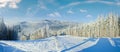 Winter mountain landscape with ski lift and skiing slope. Bukovel ski resort, Ukraine Royalty Free Stock Photo