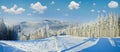 Winter mountain landscape with ski lift and skiing slope Royalty Free Stock Photo