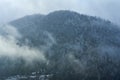 Winter mountain landscape. Small town between mountains. A cloud hangs over the city Royalty Free Stock Photo