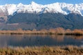 Winter mountain landscape with snow-capped mountains and lake Royalty Free Stock Photo