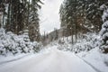 Winter mountain landscape with snowy forest road, outdoor travel and transportation background Royalty Free Stock Photo
