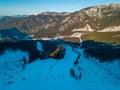 Winter Mountain Peaks and Ski Slopes in Sunny Weather. Aerial View Royalty Free Stock Photo