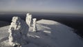 Winter mountain view from a bird's-eye view. Clip.Big mountains under snow and ice on a snowy mountain and a green Royalty Free Stock Photo