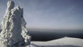 Winter mountain view from a bird's-eye view. Clip.Big mountains under snow and ice on a snowy mountain and a green Royalty Free Stock Photo