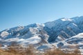 Winter mountain with white snow peak. Panoramic view of snowcapped mountains. Winter. beautiful clear blue sky in Royalty Free Stock Photo