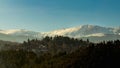 Winter mountains and green forest, snow on the mountains