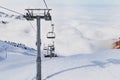 Winter mountains panorama with ski slopes and ski lifts in Tian Shan Royalty Free Stock Photo