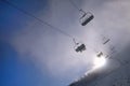 Winter mountains panorama with ski slopes and ski lifts, sunny Royalty Free Stock Photo