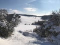 Snow blanket covers the hills in a countryside in winter