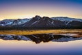 Winter mountains reflection at sunset in a lake Royalty Free Stock Photo