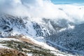 Winter in mountains, snowy landscape and grey meadow, background photo Royalty Free Stock Photo