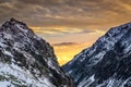 Winter mountains at sunset with colorful clouds and sky Royalty Free Stock Photo