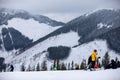 winter mountains view ski resort slopes people skiing and snowboarding Royalty Free Stock Photo
