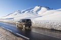 Winter moutain scenery, alpine road in Austrian, car speeding Royalty Free Stock Photo