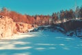 Frozen lake with a rocky shore