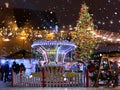 Winter night ,Christmas in the city  holiday New year  evening light moon and snowflakes in Tallinn old town square Christmas tree Royalty Free Stock Photo