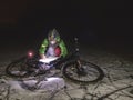 Winter night extreme biker control navigation Royalty Free Stock Photo