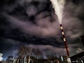 Winter night industrial landscape. Coal-fired power station with smoking chimneys against dramatic dark sky. Air Royalty Free Stock Photo