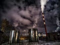 Winter night industrial landscape. Coal-fired power station with smoking chimneys against dramatic dark sky. Air Royalty Free Stock Photo