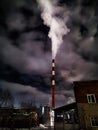 Winter night industrial landscape. Coal-fired power station with smoking chimneys against dramatic dark sky. Air Royalty Free Stock Photo