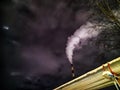 Winter night industrial landscape. Coal-fired power station with smoking chimneys against dramatic dark sky. Air Royalty Free Stock Photo