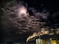 Winter night industrial landscape. Coal-fired power station with smoking chimneys against dramatic dark sky. Air Royalty Free Stock Photo