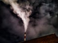 Winter night industrial landscape. Coal-fired power station with smoking chimneys against dramatic dark sky. Air Royalty Free Stock Photo