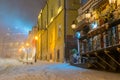 Winter night landscape, evening in the night snowy street under snowfall Royalty Free Stock Photo