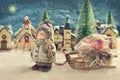 Winter night scene with a boy pulling a slad with christmas gift Royalty Free Stock Photo