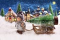 Winter night scene with a boy pulling a slad with christmas tree Royalty Free Stock Photo