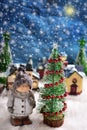 Winter night scene with a boy standing by the christmas tree Royalty Free Stock Photo