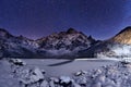 Winter night. Starry sky above mountain peak. Royalty Free Stock Photo