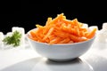 Winter nourishment Frozen cut carrot in white bowl, healthy food