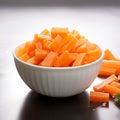 Winter nourishment Frozen cut carrot in white bowl, healthy food