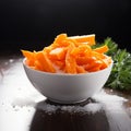 Winter nourishment Frozen cut carrot in white bowl, healthy food