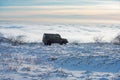 Winter off road in mountains. Offroad in beautiful snowy winter forest.