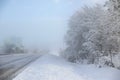 Winter old American Country landscape with rustic houses, cars and fences covered in snow Royalty Free Stock Photo