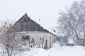 Winter, old dilapidated barn. A lot of snow around