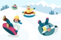 Cheerful boys and girls slide down the hill on snow tubing