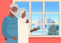 Happy elderly couple looking out the window at winter landscape Royalty Free Stock Photo