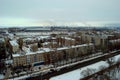 Winter panorama of the city of Tolyatti overlooking residential areas and smoking chimneys of chemical plants.