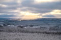 Winter panorama landscape with forest, trees covered snow and sunset. winterly morning of a new day. Cloudy winter landscape with Royalty Free Stock Photo